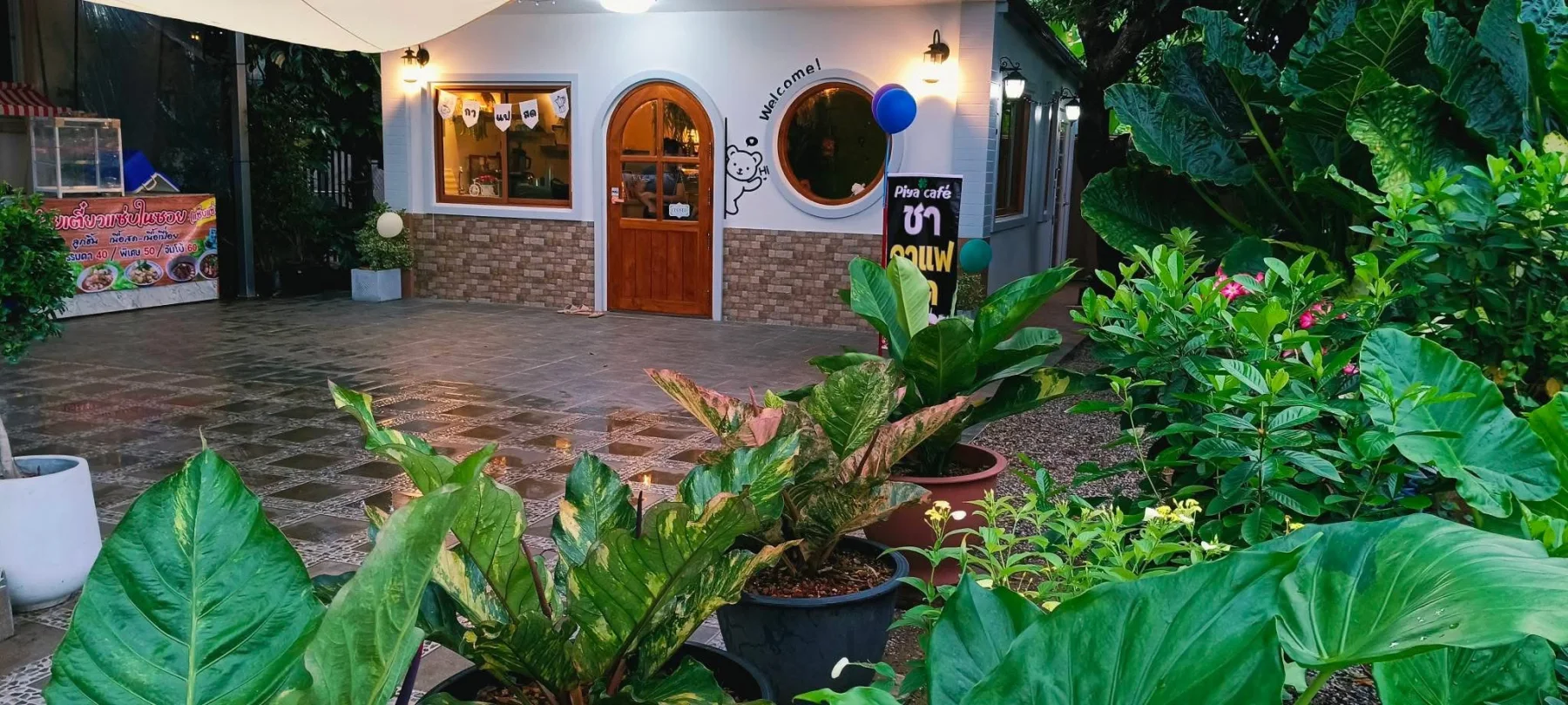 PIYA Café surrounded by tropical plants